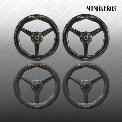 Monókeros Poseidon tri-spoke front wheel — matte carbon with gold lettering