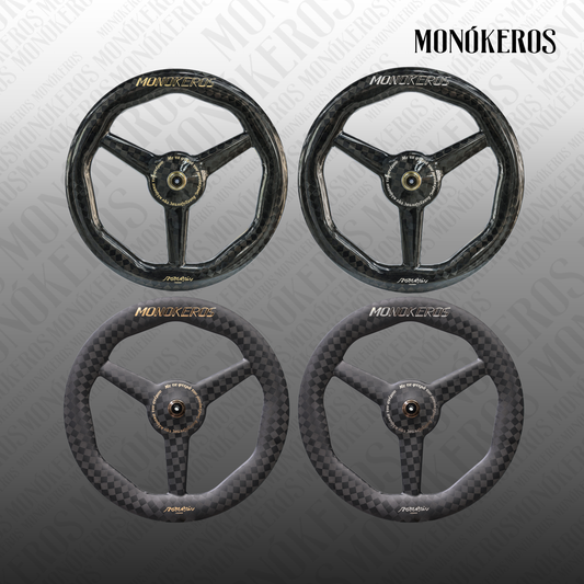 Monókeros Poseidon tri-spoke front wheel — matte carbon with gold lettering