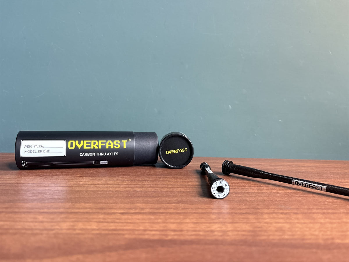 OVERFAST carbon thru-axle — axle and packaging tube