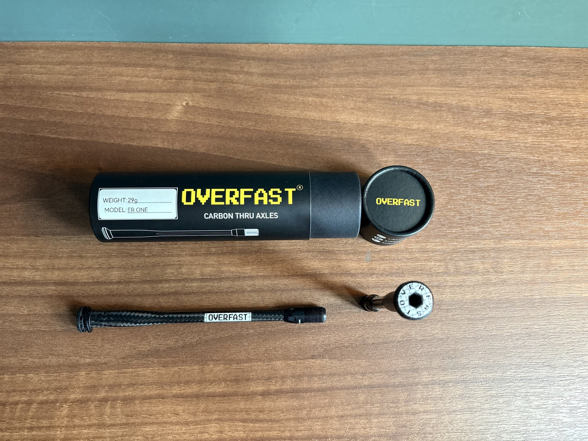 OVERFAST carbon thru-axle with storage tube and end cap